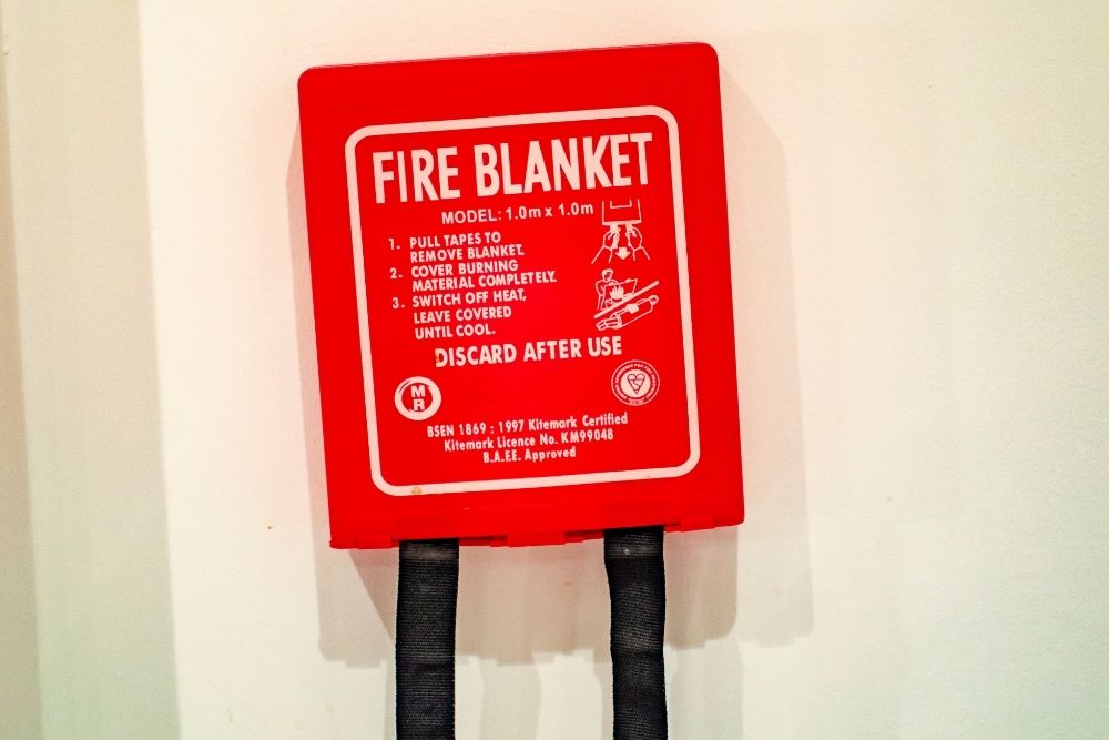 How Does A Fire Blanket Work? (Including VS Fire Extinguishers)