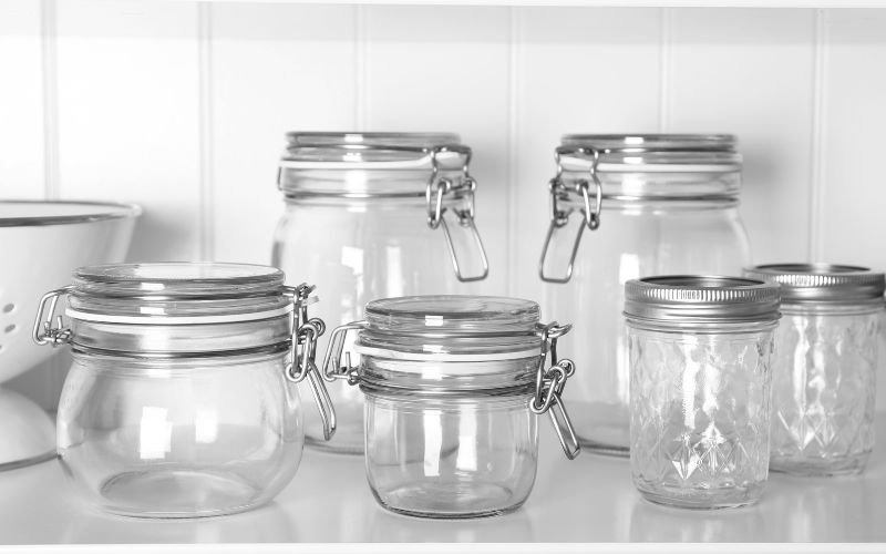 Six pieces mason jars on a light colored background